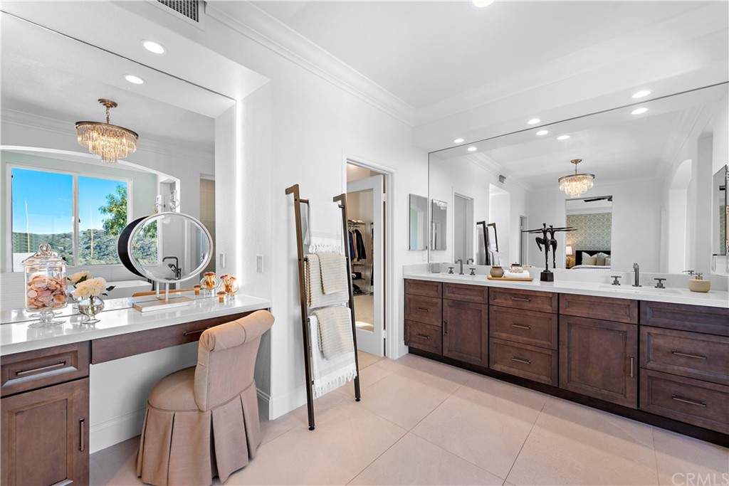 37 Oak View Drive Aliso Viejo, CA 92656 - Photo 27 of 46 a bathroom with a double vanity sink and a mirror