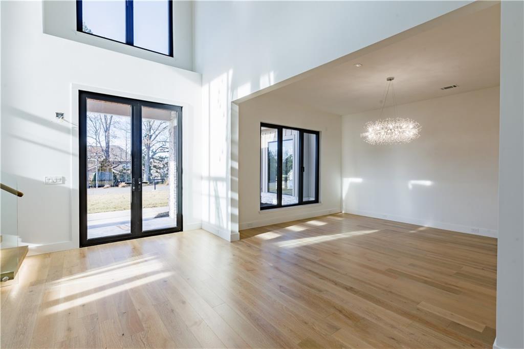 4805 Moore Road Suwanee, GA 30024 - Photo 107 of 119 a view of an empty room with glass door and a window
