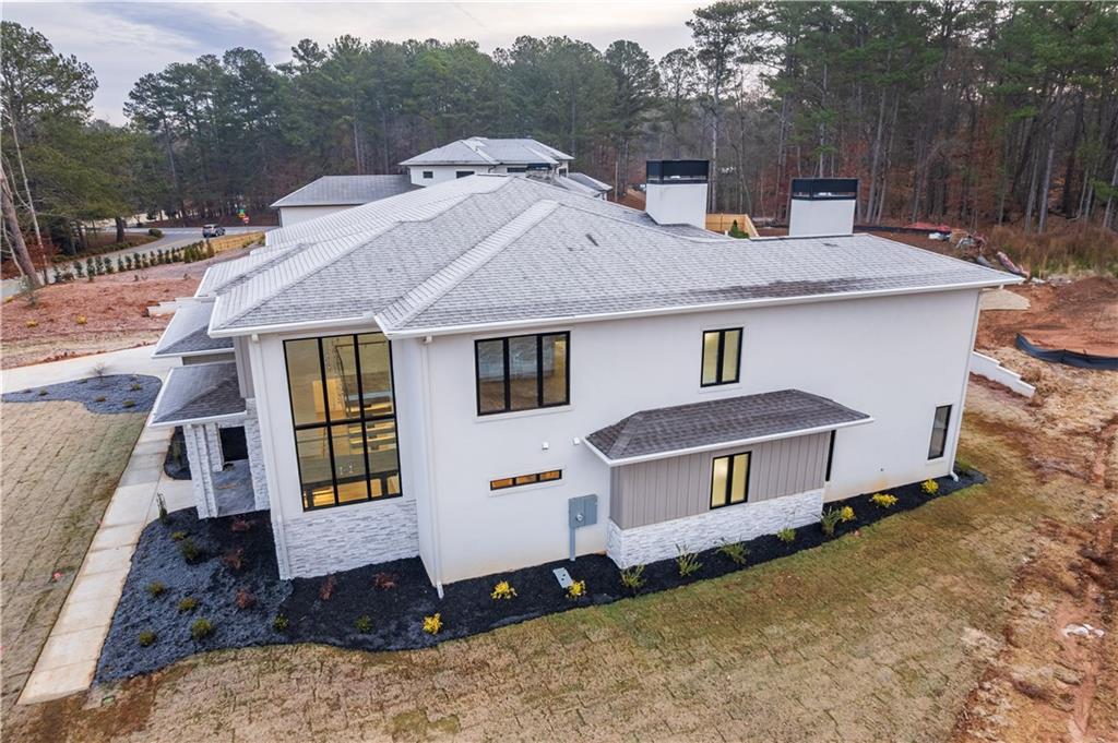 4805 Moore Road Suwanee, GA 30024 - Photo 119 of 119 a front view of a house with a yard