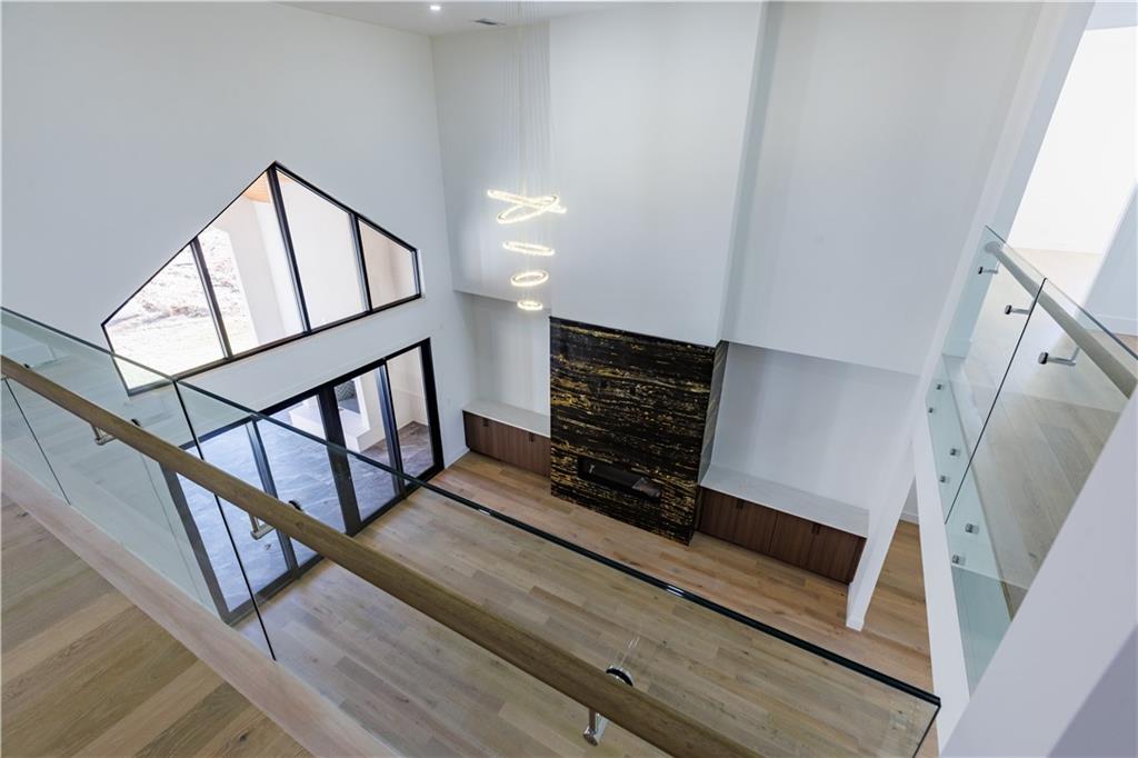 4805 Moore Road Suwanee, GA 30024 - Photo 13 of 119 a view of staircase with white walls and a window