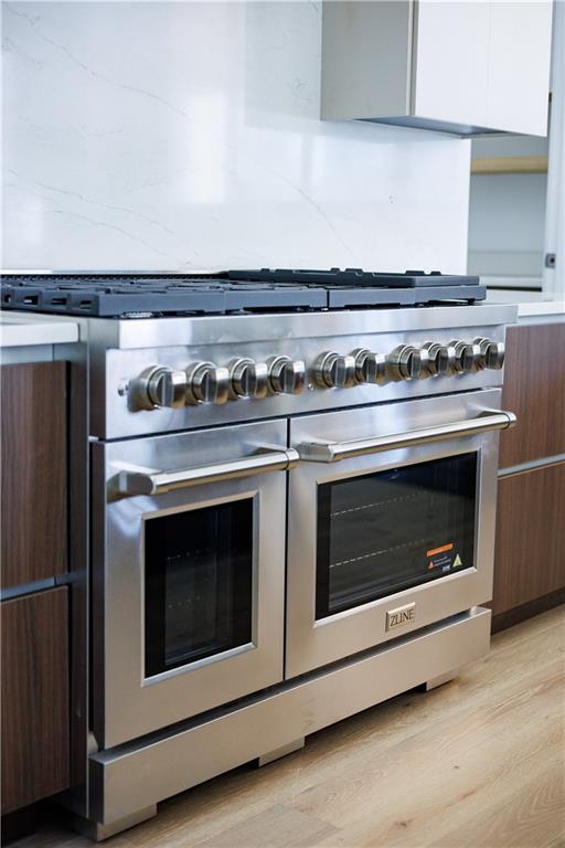 4805 Moore Road Suwanee, GA 30024 - Photo 18 of 119 a stove top oven sitting inside of a kitchen
