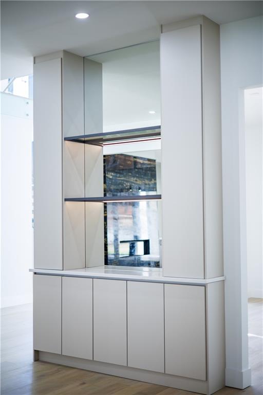 4805 Moore Road Suwanee, GA 30024 - Photo 21 of 119 a kitchen with a refrigerator and white cabinets
