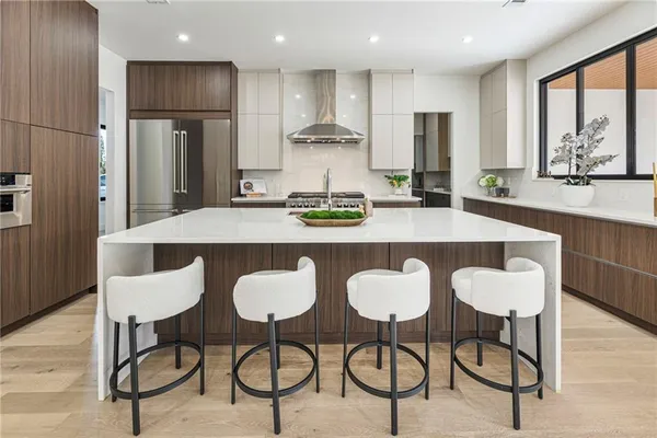 a view of an empty room with large windows and view of swimming pool