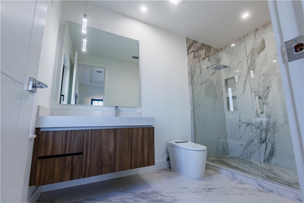 4805 Moore Road Suwanee, GA 30024 - Photo 29 of 119 a bathroom with a sink and a mirror