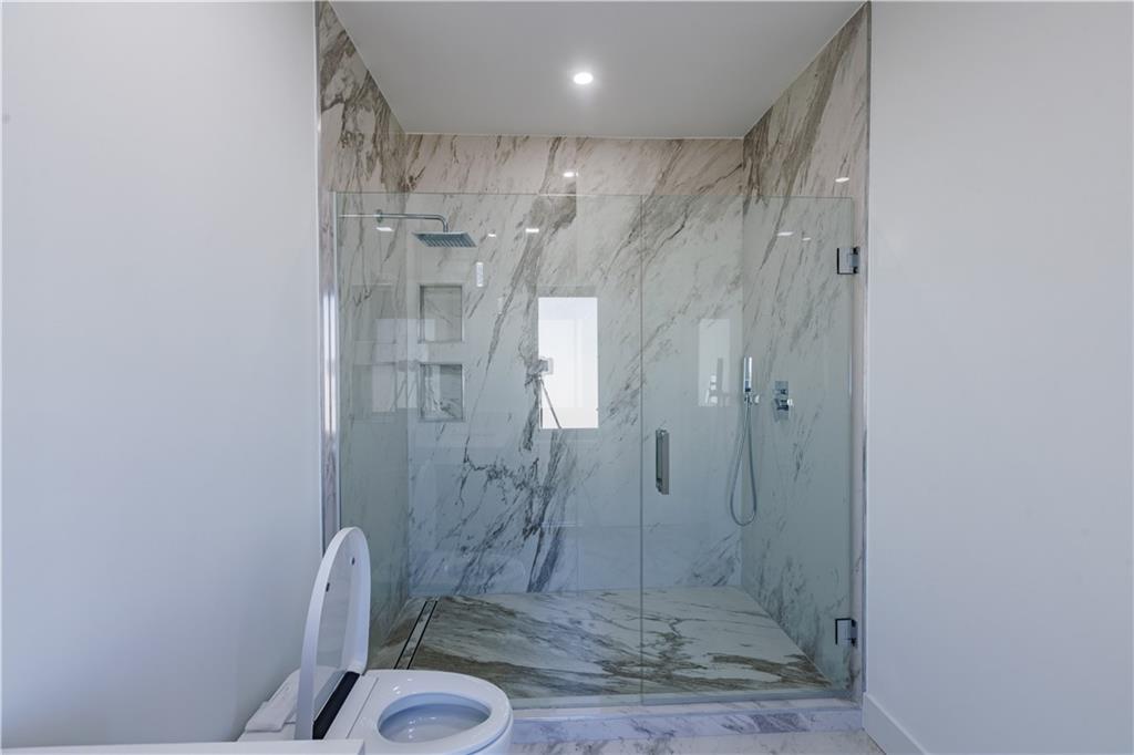 4805 Moore Road Suwanee, GA 30024 - Photo 35 of 119 a bathroom with a shower