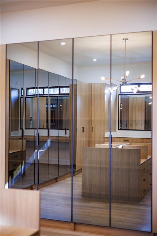 4805 Moore Road Suwanee, GA 30024 - Photo 36 of 119 a bathroom with a glass shower door and a sink