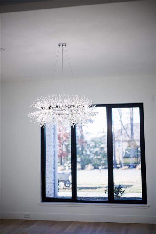 4805 Moore Road Suwanee, GA 30024 - Photo 41 of 119 a view of a room with a large window and chandelier