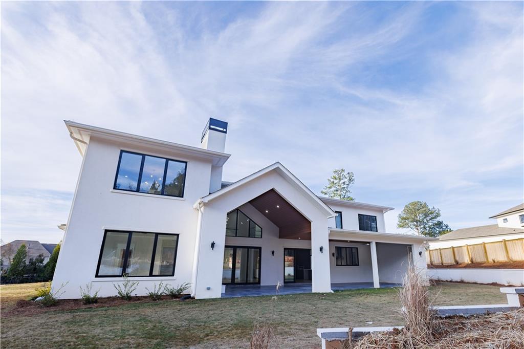 4805 Moore Road Suwanee, GA 30024 - Photo 63 of 119 front view of a house with a yard