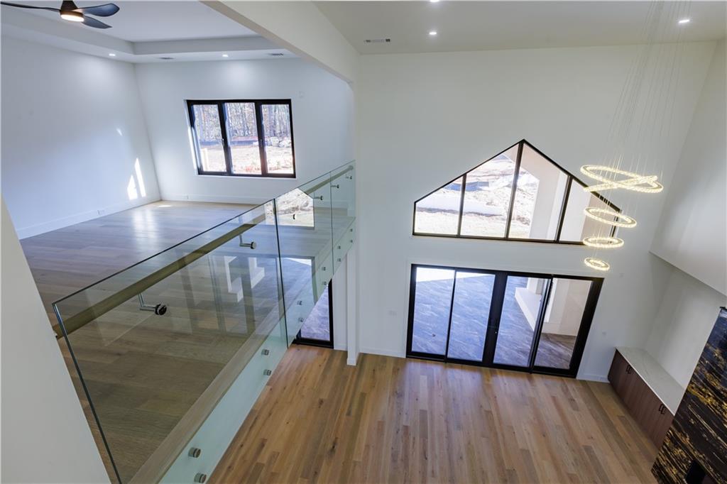 4805 Moore Road Suwanee, GA 30024 - Photo 64 of 119 a view of entryway and hall with wooden floor