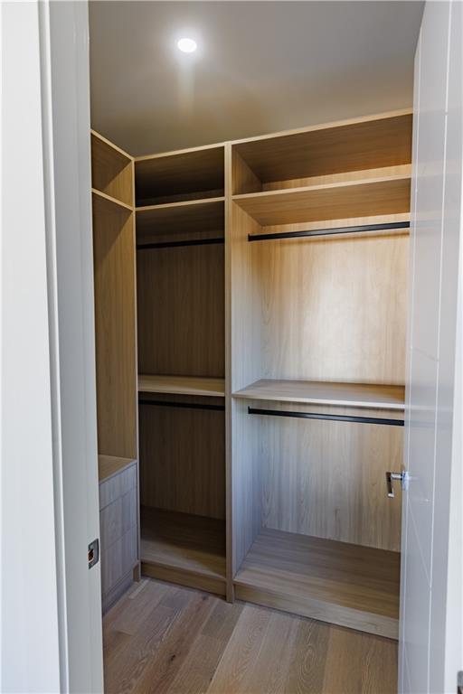 4805 Moore Road Suwanee, GA 30024 - Photo 68 of 119 a view of walk in closet with empty racks