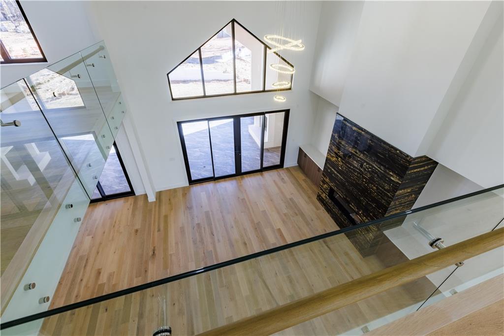 4805 Moore Road Suwanee, GA 30024 - Photo 7 of 119 wooden floor with staircase