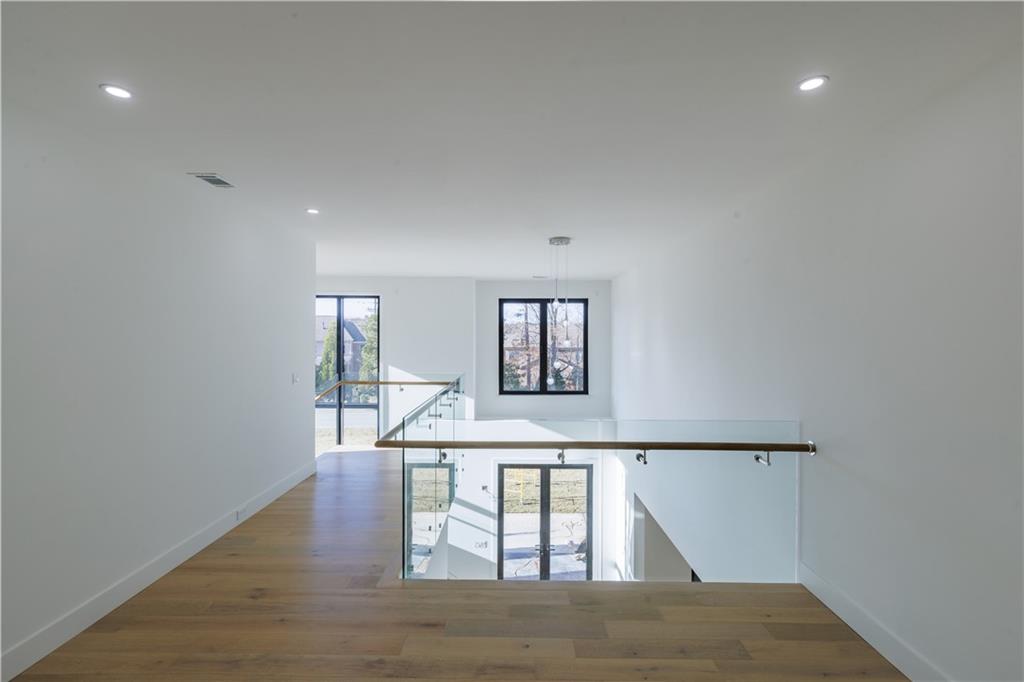 4805 Moore Road Suwanee, GA 30024 - Photo 83 of 119 a view of entryway and hall with wooden floor