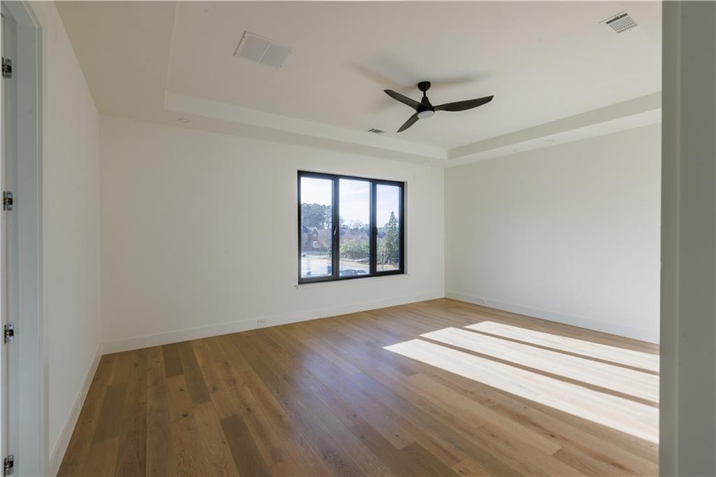4805 Moore Road Suwanee, GA 30024 - Photo 86 of 119 wooden floor in an empty room with a window