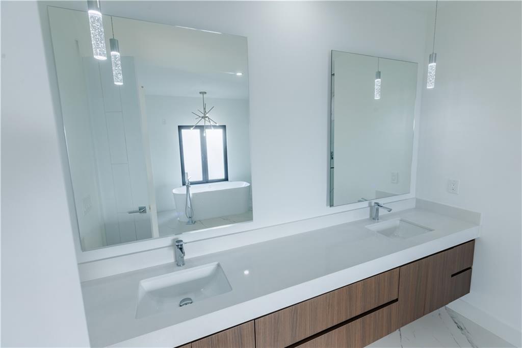 4805 Moore Road Suwanee, GA 30024 - Photo 98 of 119 a bathroom with a sink and a mirror