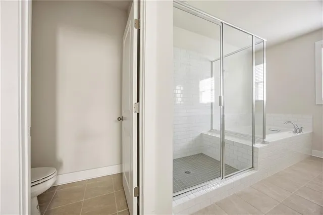 a bathroom that has a glass shower door