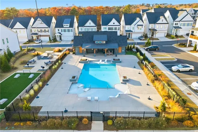 an aerial view of a house with swimming pool