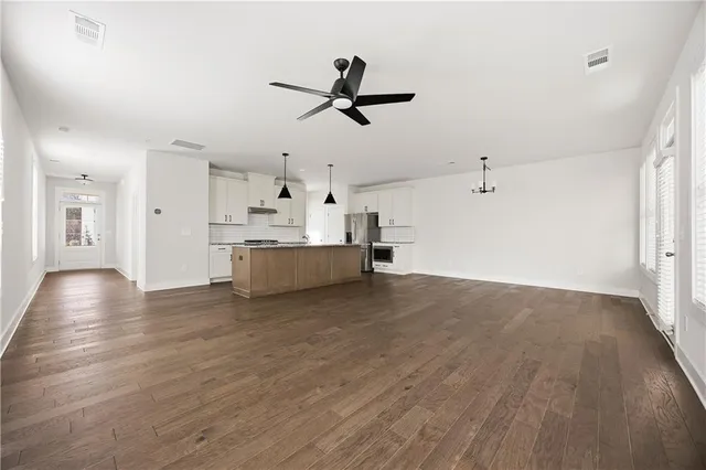 a view of a kitchen with a sink and a window