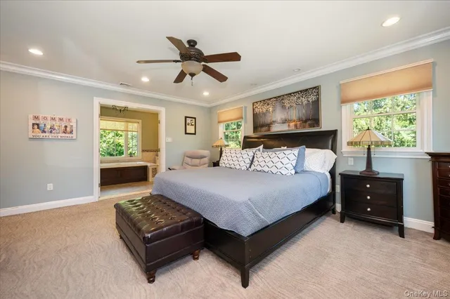 a bedroom with a large bed and a window