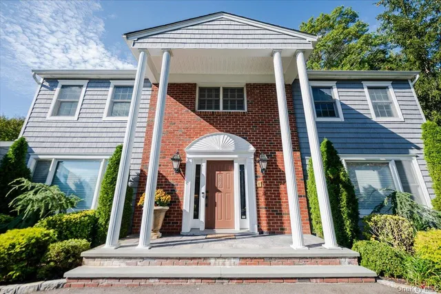 front view of a house with a small yard