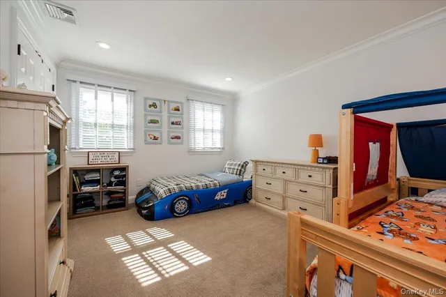 a bedroom with furniture and a window