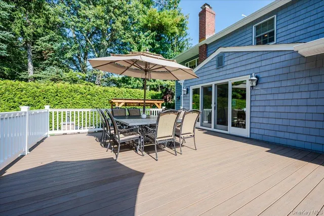 an outdoor space with furniture and umbrella
