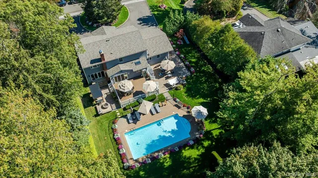 an aerial view of a house with outdoor space