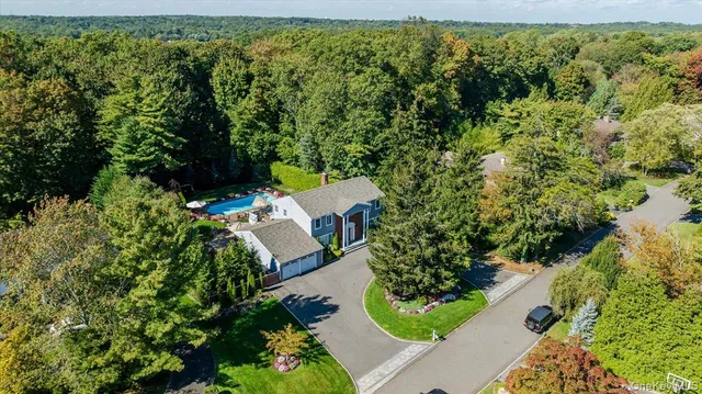 an aerial view of house with yard