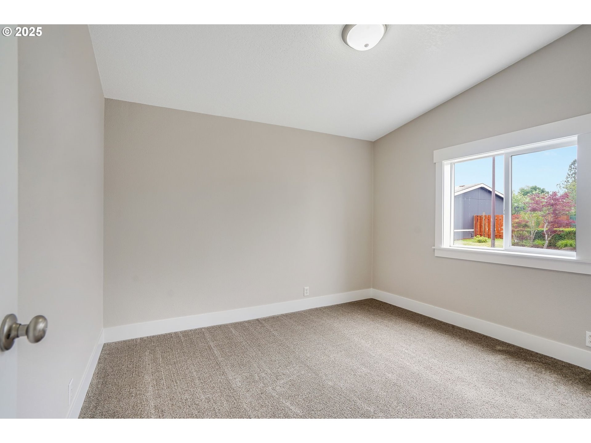 1015 Oak Street, Unit 74 Silverton, OR 97381 - Photo 25 of 33 a view of an empty room with a window