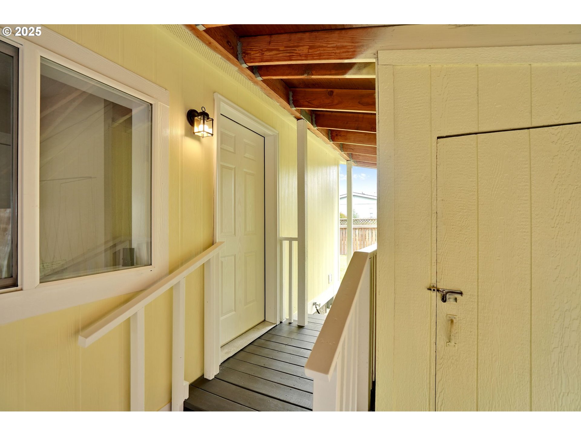 1015 Oak Street, Unit 74 Silverton, OR 97381 - Photo 5 of 33 a view of a hallway with wooden floor and staircase