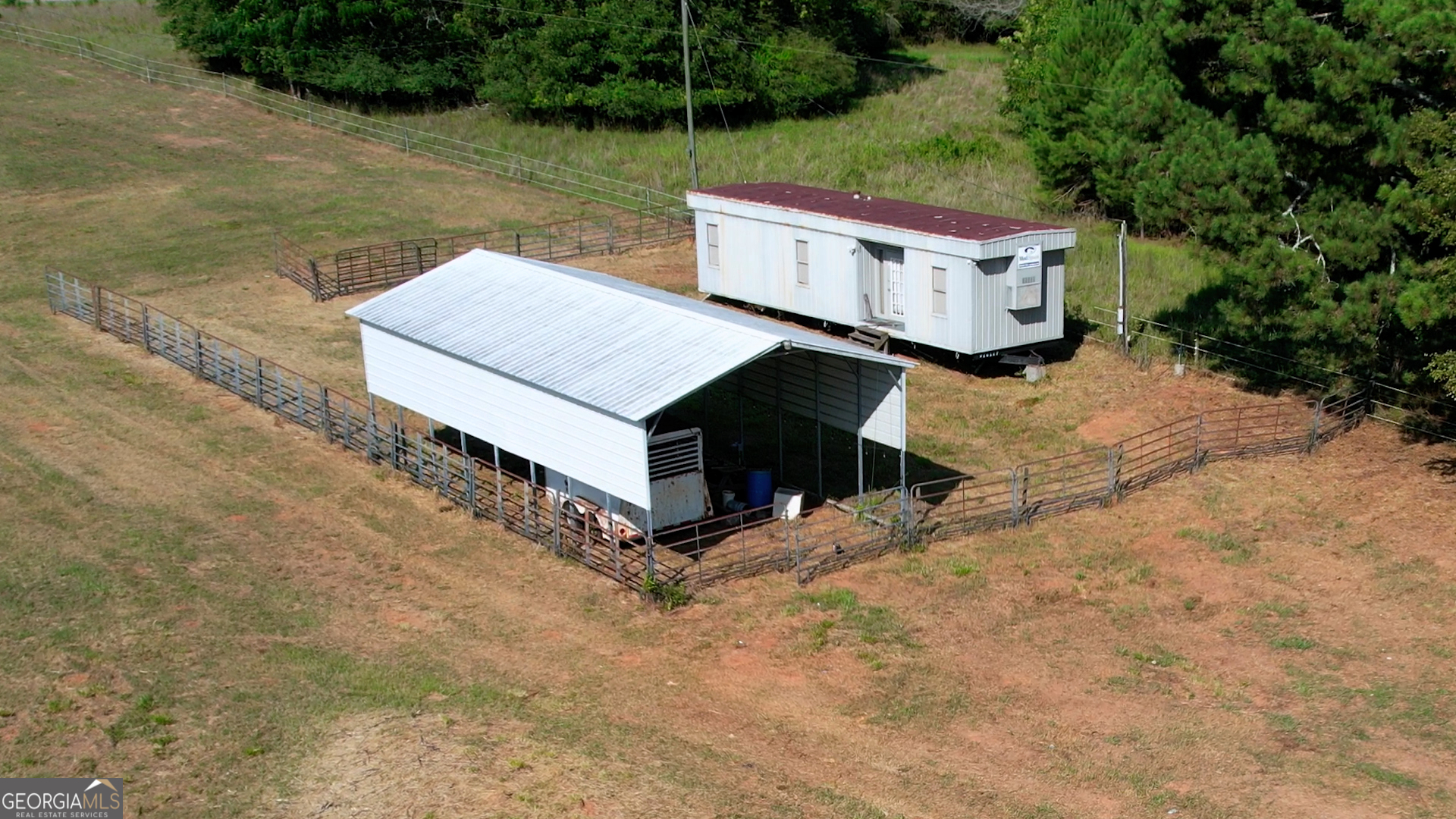2911 A Sandy Creek Road Madison, GA 30650 - Photo 11 of 41 a view of a two chairs in the backyard