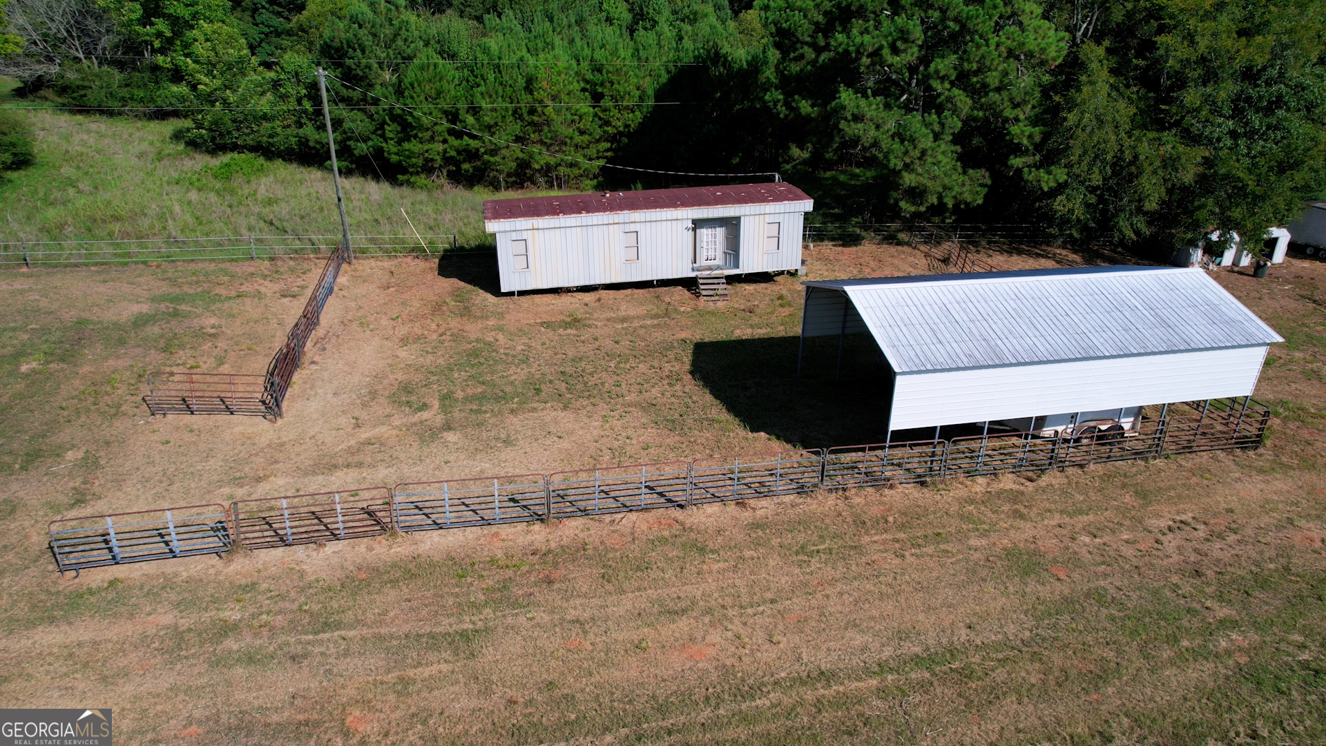 2911 A Sandy Creek Road Madison, GA 30650 - Photo 12 of 41 a parking space with tall trees