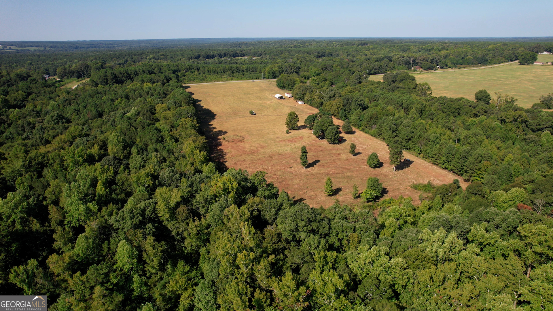 2911 A Sandy Creek Road Madison, GA 30650 - Photo 20 of 41 a view of a lake with a yard