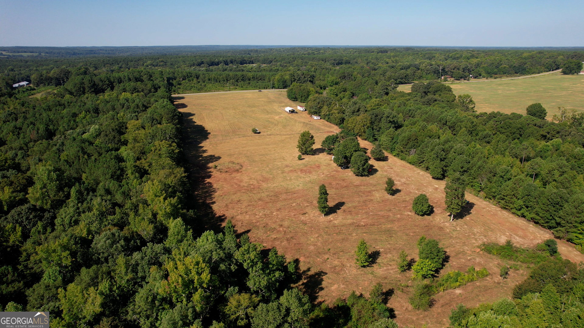 2911 A Sandy Creek Road Madison, GA 30650 - Photo 21 of 41 an aerial view of a house with a lake view