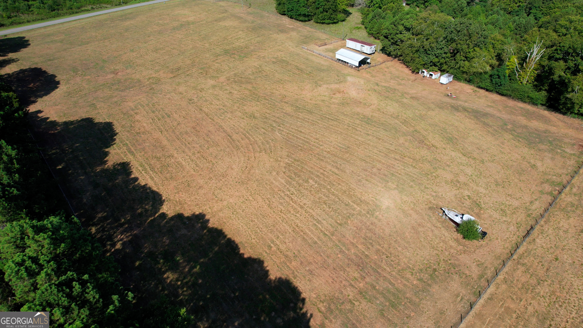2911 A Sandy Creek Road Madison, GA 30650 - Photo 26 of 41 a view of a backyard of a building