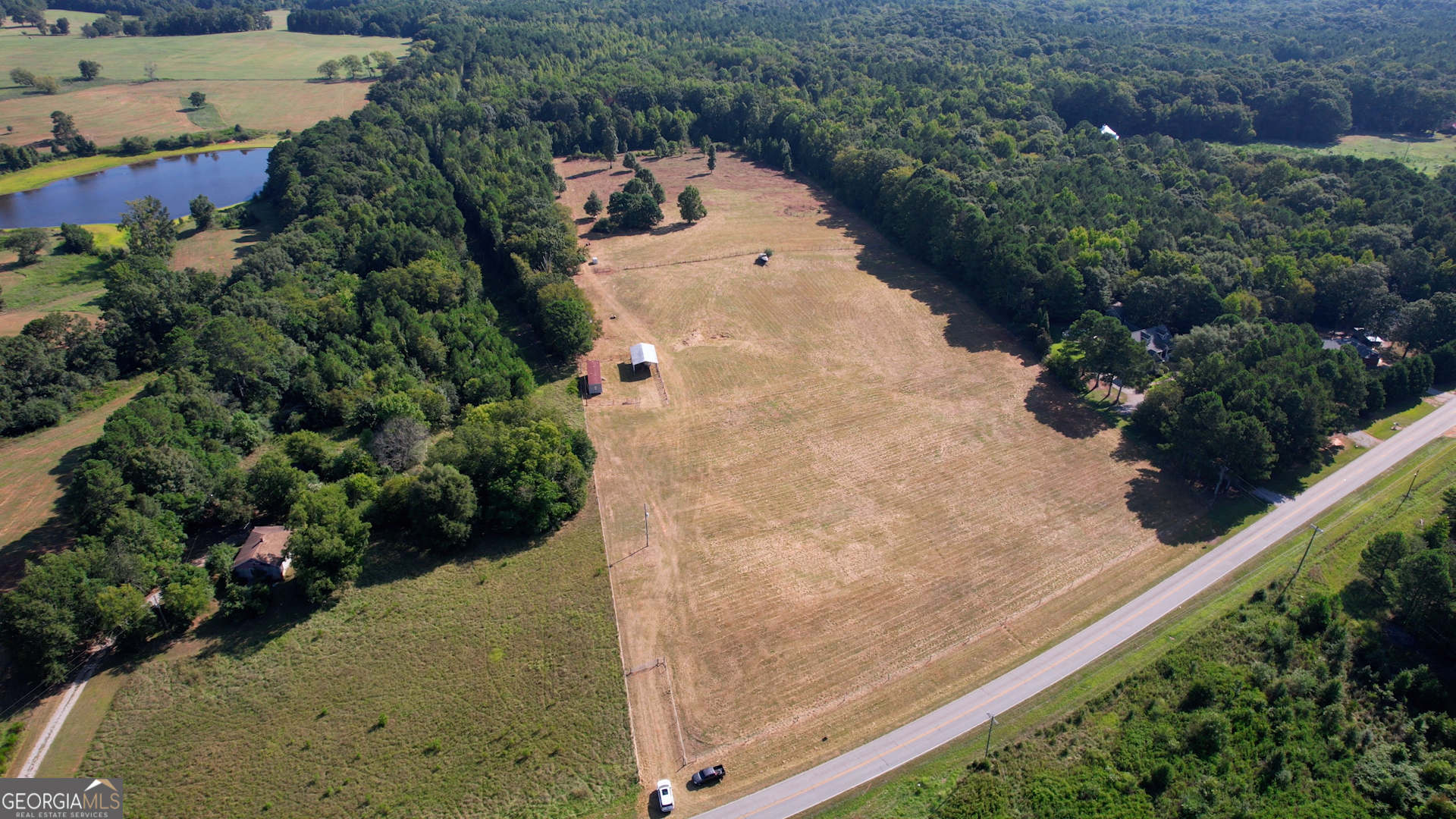 2911 A Sandy Creek Road Madison, GA 30650 - Photo 3 of 41 a view of a yard with plants