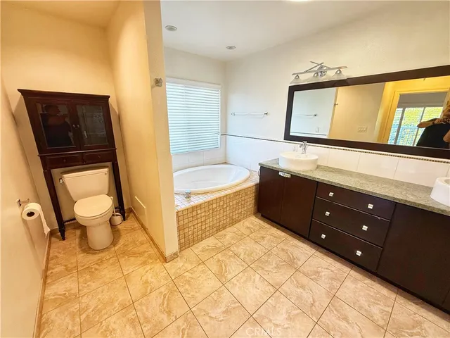 a bathroom with a sink a mirror and a bathtub