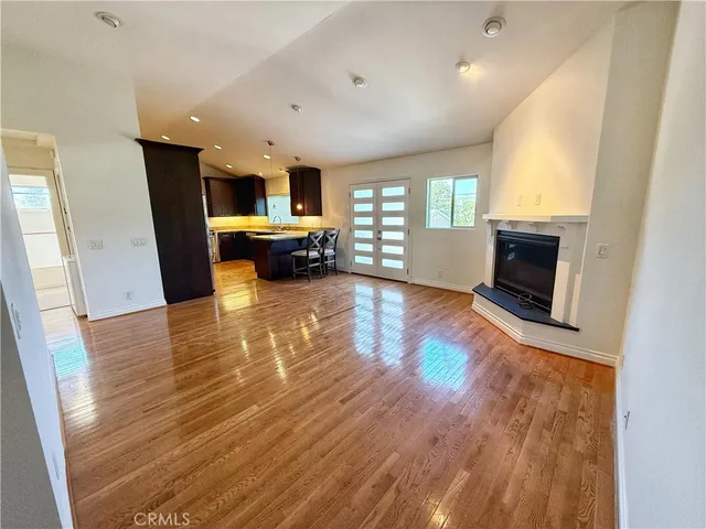wooden floor in an empty room with a fireplace