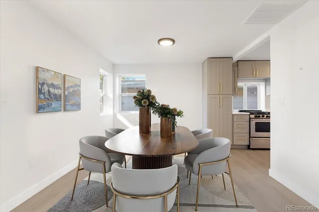 a dining room with furniture and window
