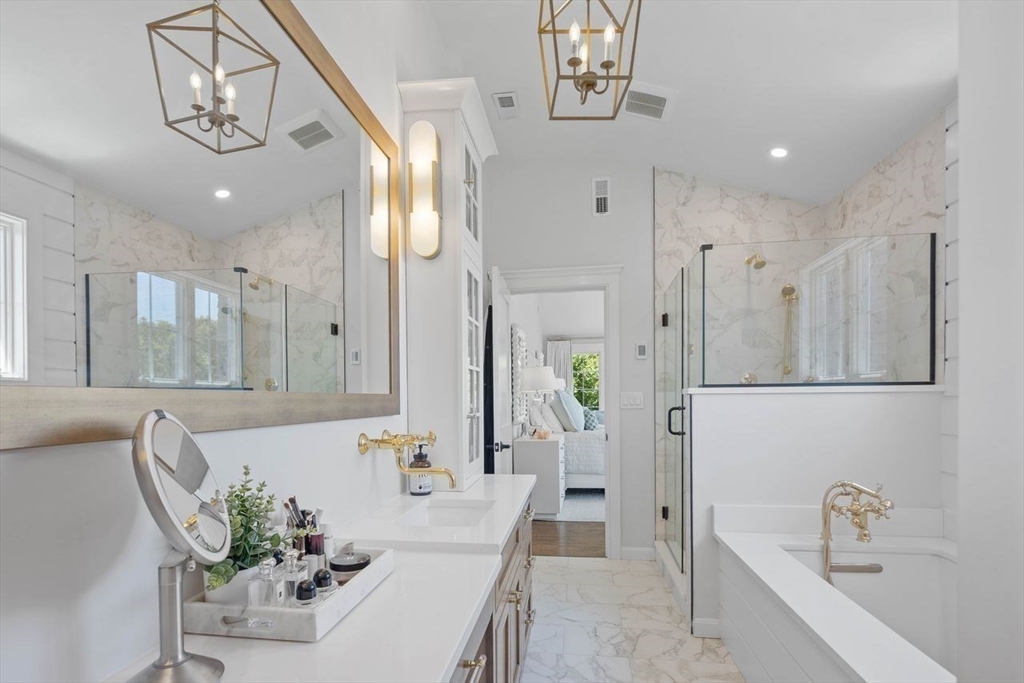 31 Bow Street Cohasset, MA 02025 - Photo 20 of 42 a spacious bathroom with a bathtub shower and sink