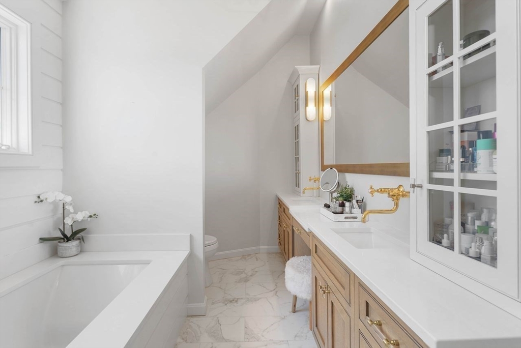 31 Bow Street Cohasset, MA 02025 - Photo 21 of 42 a bathroom with a bathtub sink and mirror
