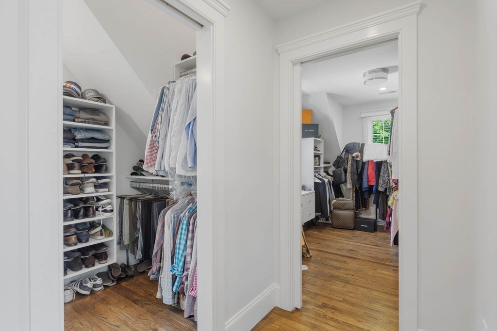 31 Bow Street Cohasset, MA 02025 - Photo 22 of 42 a view of walk in closet with clothes and shoes
