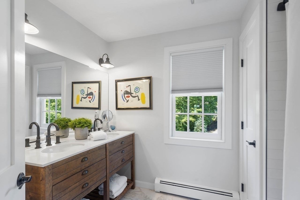 31 Bow Street Cohasset, MA 02025 - Photo 29 of 42 a bathroom with a double vanity sink window and a mirror