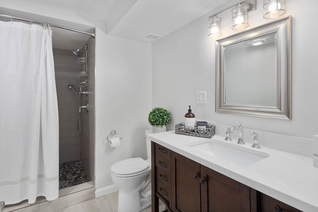 31 Bow Street Cohasset, MA 02025 - Photo 34 of 42 a bathroom with a granite countertop sink toilet and shower