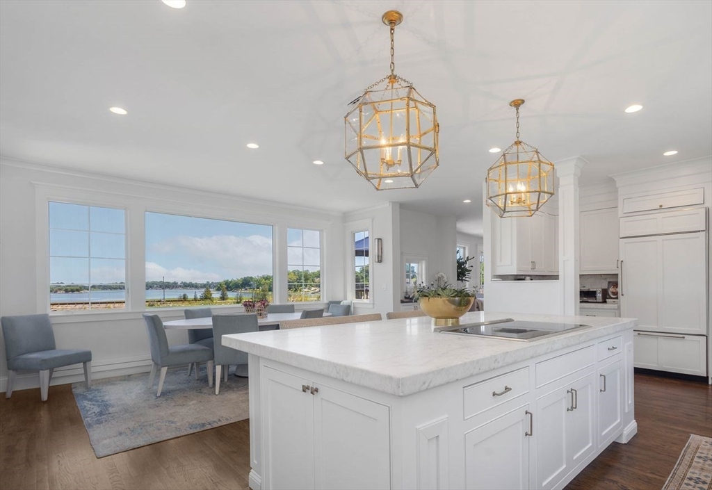 31 Bow Street Cohasset, MA 02025 - Photo 4 of 42 a kitchen with a counter space a sink appliances and cabinets