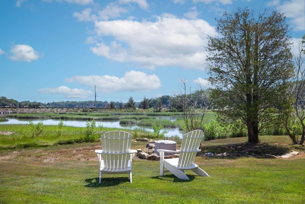 31 Bow Street Cohasset, MA 02025 - Photo 41 of 42 a view of a lake with table and chairs