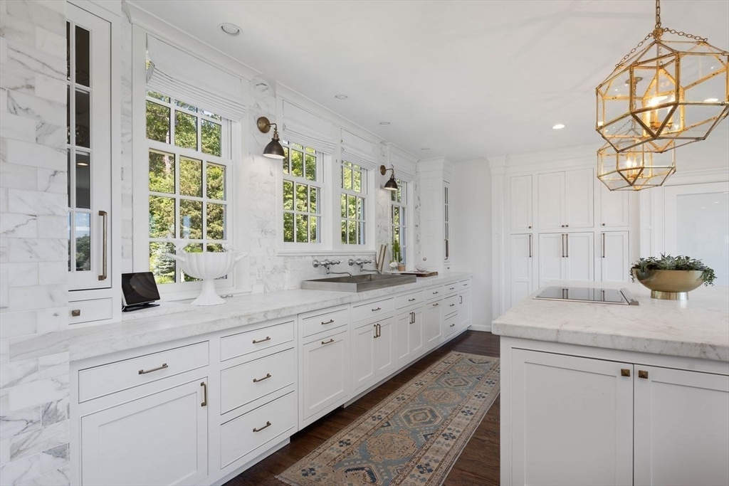 31 Bow Street Cohasset, MA 02025 - Photo 7 of 42 a bathroom with a sink and a mirror