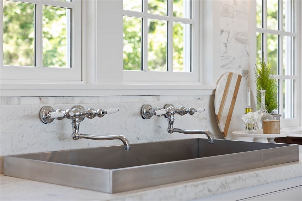 31 Bow Street Cohasset, MA 02025 - Photo 8 of 42 a view of a bath tub sitting in a bathroom next to a window
