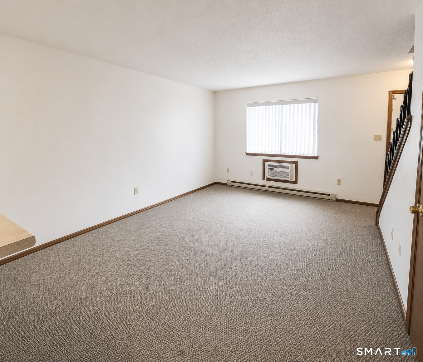 975 Meriden Road, Unit 101 Waterbury, CT 06705 - Photo 12 of 28 an empty room with windows