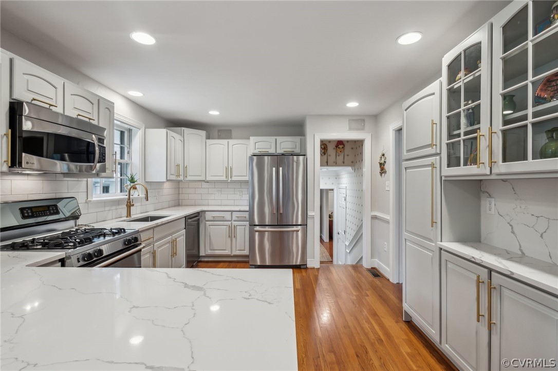 2610 Kentford Road Midlothian, VA 23113 - Photo 8 of 40 a kitchen with stainless steel appliances a refrigerator a stove a sink and a microwave