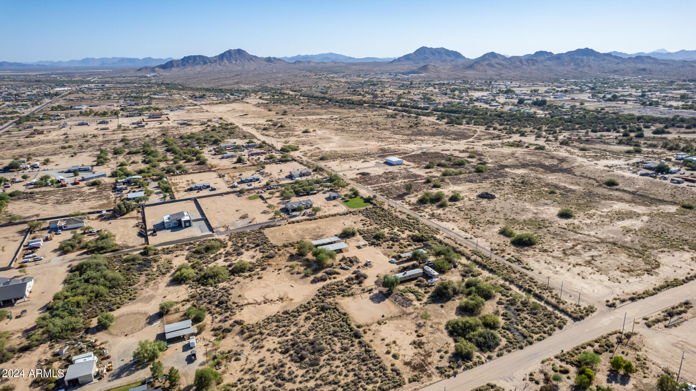 21235 West Elliot Road Buckeye, AZ 85326 - Photo 11 of 16 an aerial view of residential houses with outdoor space and trees